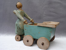 Charger l&#39;image dans la galerie, Ancienne poupée naïve avec landau en bois peint